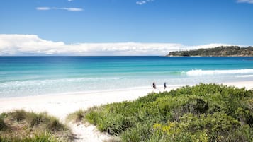 Walking along the beach, guests can enjoy the serene atmosphere and stunning ocean views.