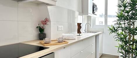 Fridge, microwave, stovetop, coffee/tea maker