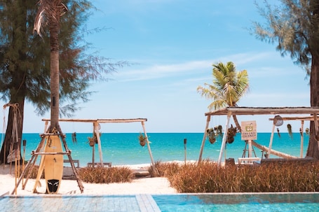 On the beach, white sand, 2 beach bars