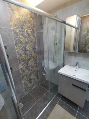 Shower, hair dryer, towels, soap