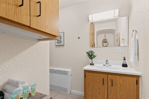 Hair dryer, towels, soap, shampoo