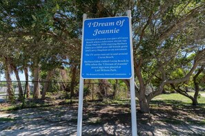 A signboard titled "I Dream of Jeannie" with historical information about the TV series and its filming locations.
