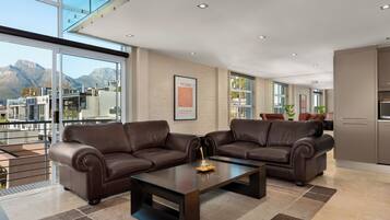 Exclusive Apartment | Living area | 50-inch flat-screen TV with cable channels, Netflix, streaming services