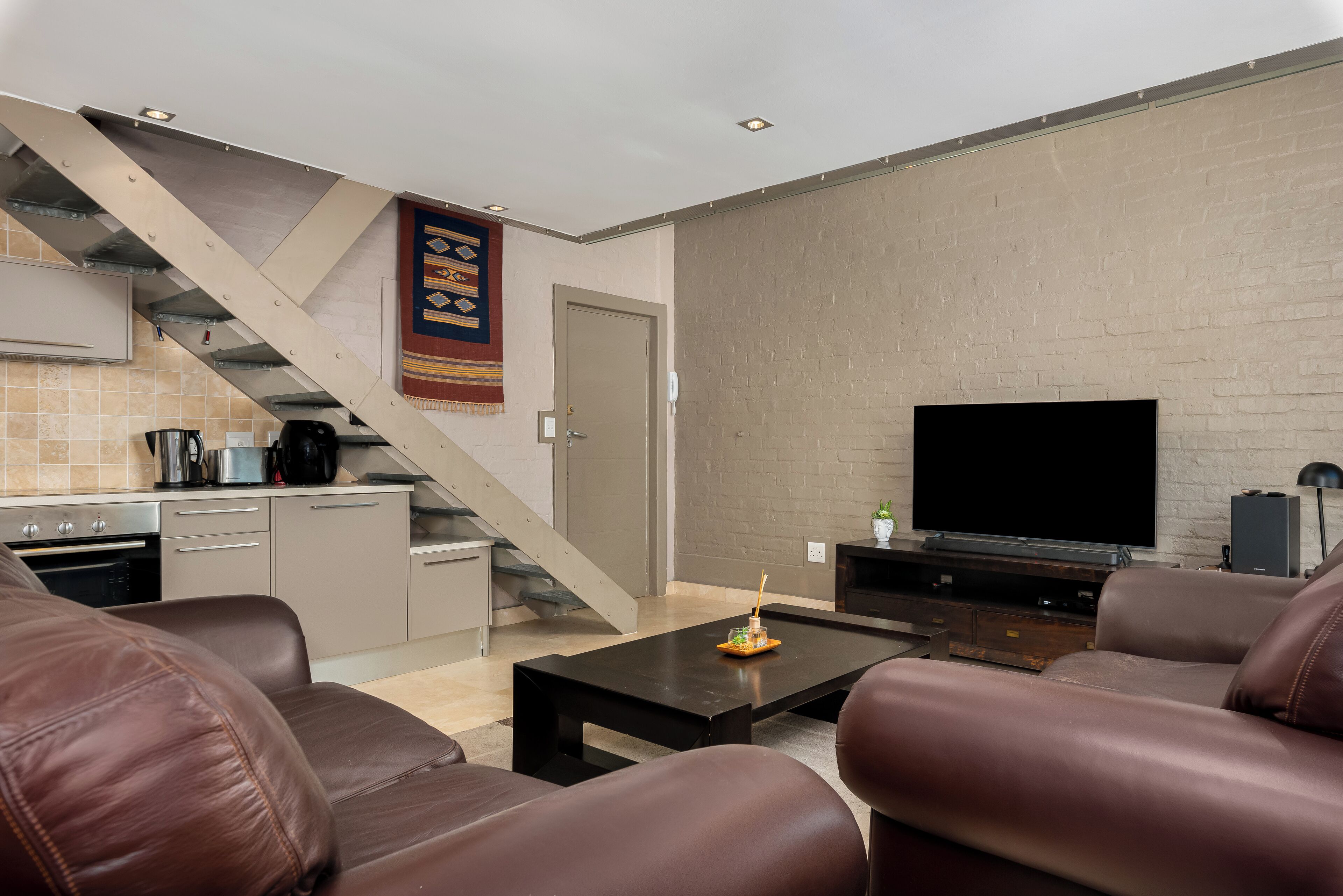 Exclusive Apartment | Living area | 50-inch flat-screen TV with cable channels, Netflix, streaming services