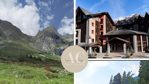 A mountain landscape with a building featuring stone and wood construction, a castle-like structure, and a grassy field with wildflowers. - Acquaseria 310 in Ponte di Legno (Ponte di Legno)
