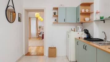 Fridge, microwave, stovetop, coffee/tea maker