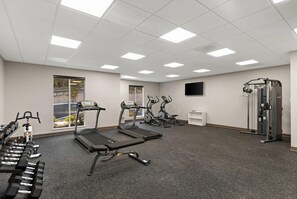 A gym with treadmills, elliptical machines, and free weights. - Mainstay Suites Gatlinburg TN (Gatlinburg)
