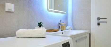 Shower, hair dryer, towels