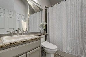 Bathtub, hair dryer, towels
