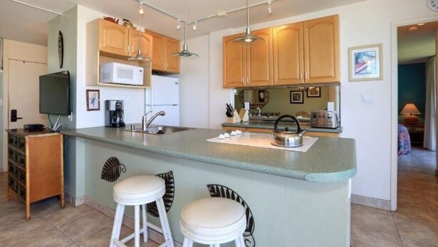 Condo, 2 phòng ngủ | Bếp riêng | Dụng cụ pha cà phê/trà, tủ lạnh, lò nướng, lò nướng bánh mì 