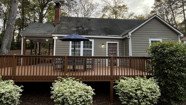 A house with a covered deck, a chimney, and a mailbox. - 5 Points House - Great Location - 3Br2Ba - Early Check-In (Athens)