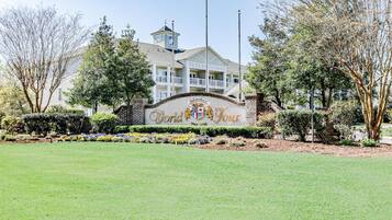 A golf course clubhouse with a sign reading "World Tour Golf Links."