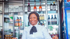 A bar with shelves of various bottles and glasses. - Eden Hotels Ltd (Eket)