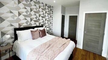 1 bedroom, desk, iron/ironing board, travel crib