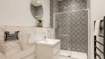 Shower, hair dryer, towels, shampoo