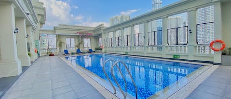 Outdoor pool, open 6:00 AM to 10:00 PM, pool umbrellas, pool loungers