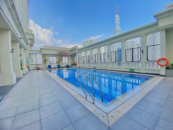 Outdoor pool, open 6:00 AM to 10:00 PM, pool umbrellas, sun loungers