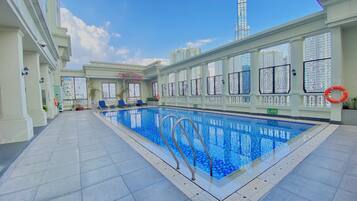 Outdoor pool, open 6:00 AM to 10:00 PM, pool umbrellas, sun loungers