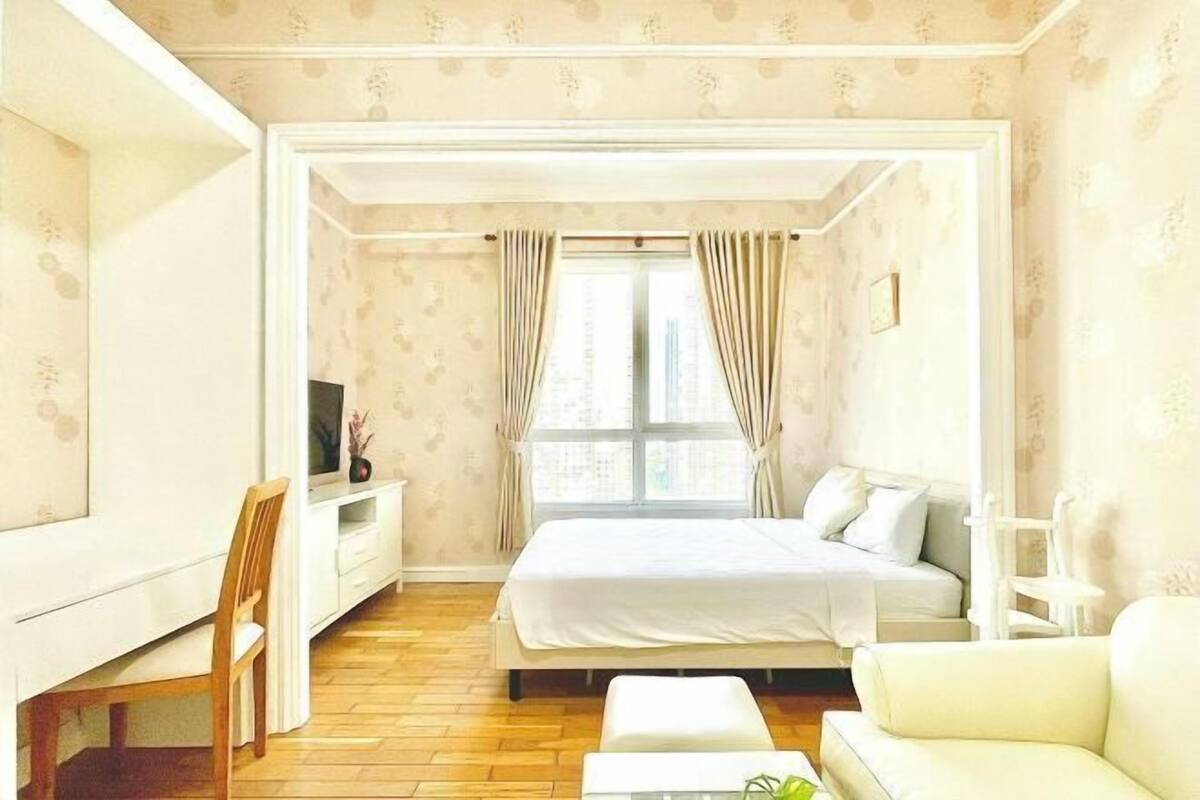 Premium bedding, laptop workspace, blackout curtains, soundproofing