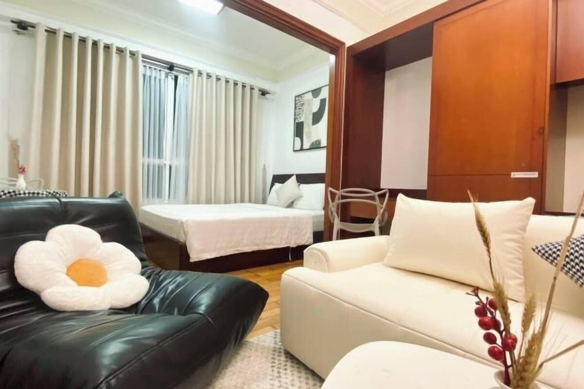 Premium bedding, laptop workspace, blackout drapes, soundproofing