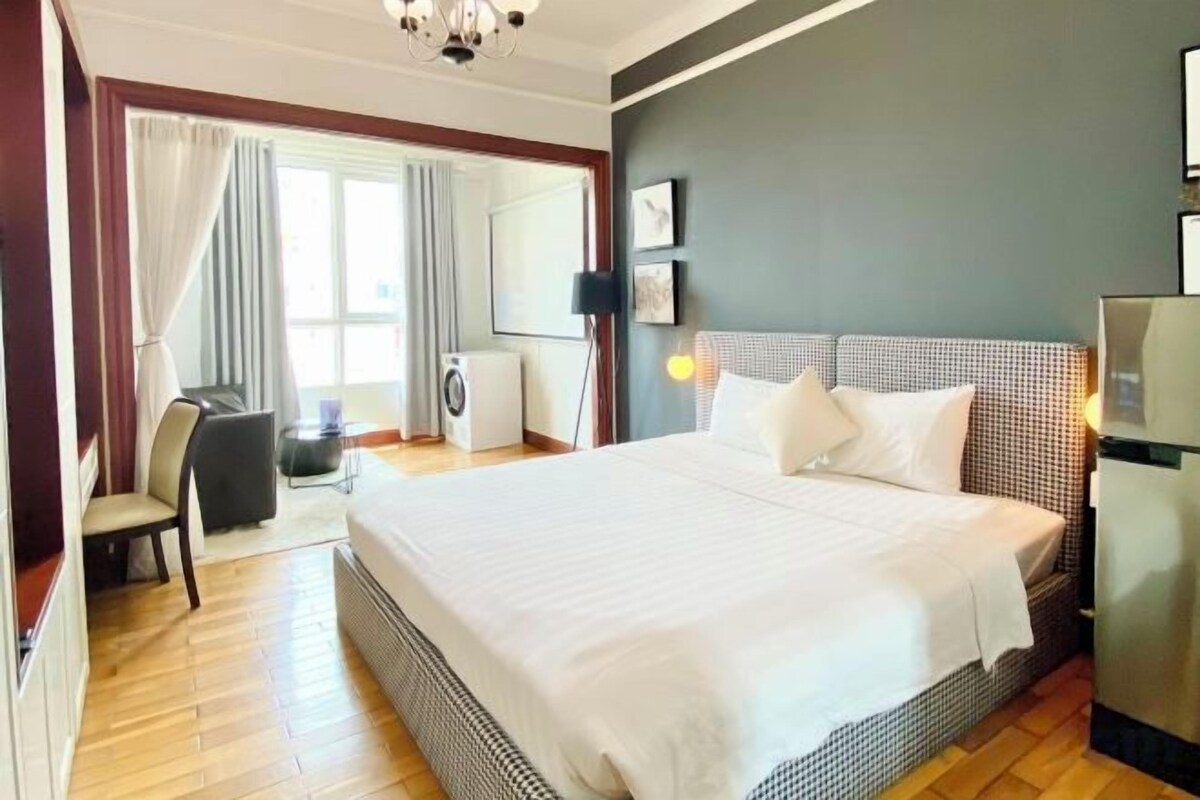 Premium bedding, laptop workspace, blackout drapes, soundproofing