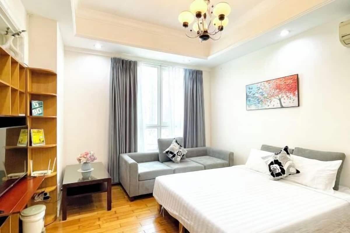 Premium bedding, laptop workspace, blackout drapes, soundproofing