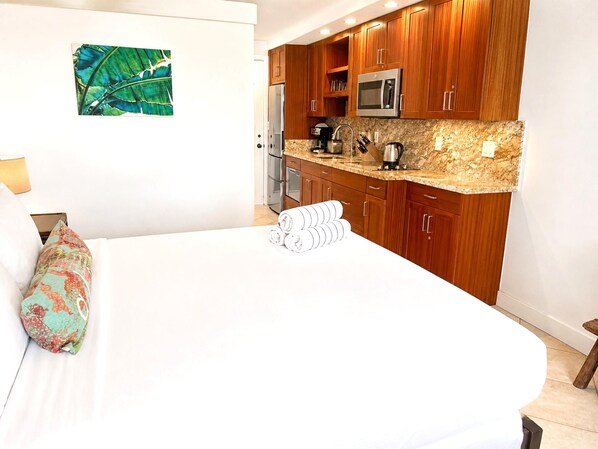 Island-inspired accents and plush linens create a peaceful sanctuary.