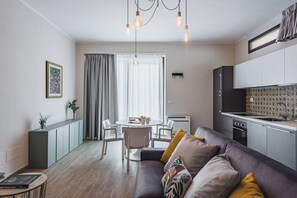 Superior Apartment | Living area | 35-inch flat-screen TV with digital channels - Venuto Homes by Wonderful Italy (Catania)