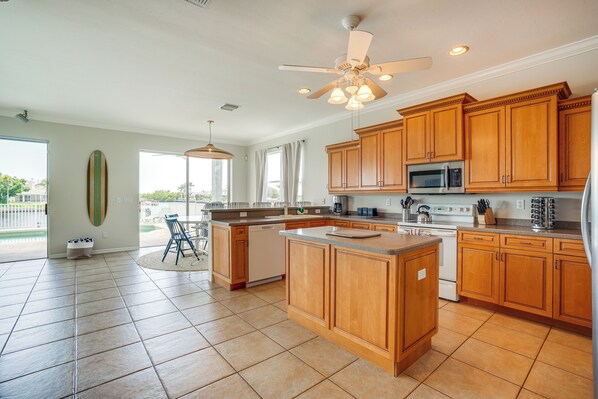 Enjoy cooking in this well-lit kitchen with ample counter space and a central island.