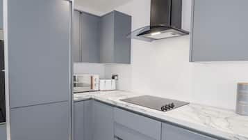 Fridge, electric kettle, toaster, cookware/dishes/utensils