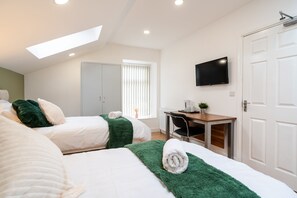Deluxe Suite, Private Bathroom (Second floor) | Memory foam beds, desk, laptop workspace, iron/ironing board
