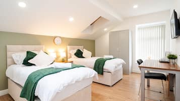 Deluxe Suite, Private Bathroom (Second floor) | Memory-foam beds, desk, laptop workspace, iron/ironing board