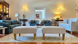 A living room with two sofas, a coffee table, and a rug.