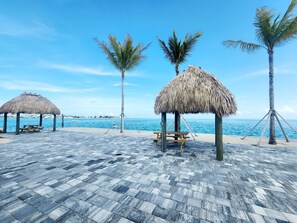 Outdoor dining - ISLE BE BACK- Brand new 1br, 2 ba condo. Catch sunset at the Olympic sized pool! (Marathon)