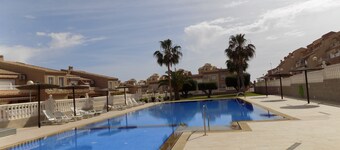 Two bedroom Town house with basement, aircon, communal pool, wifi and sea views