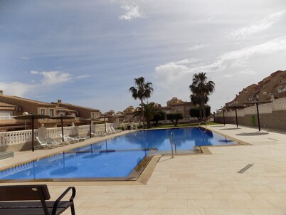Two bedroom Town house with basement, aircon, communal pool, wifi and sea views
