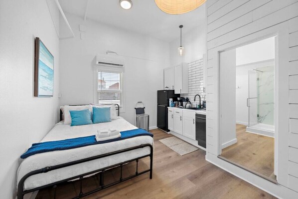 1 bedroom, desk, iron/ironing board, travel crib