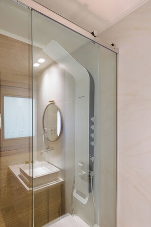 Shower, hair dryer, towels, soap
