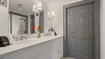 Superior Suite, 2 Bedrooms | Bathroom | Rainfall showerhead, hair dryer, bathrobes, towels