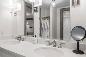 Superior Suite, 2 Bedrooms | Bathroom | Rainfall showerhead, hair dryer, bathrobes, towels