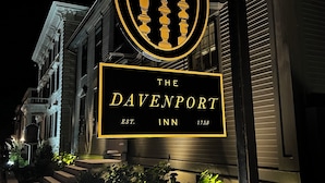 A sign for The Davenport Inn, established in 1758, with a classic design featuring a circular emblem with vertical lines. - The Davenport Inn (Portsmouth)