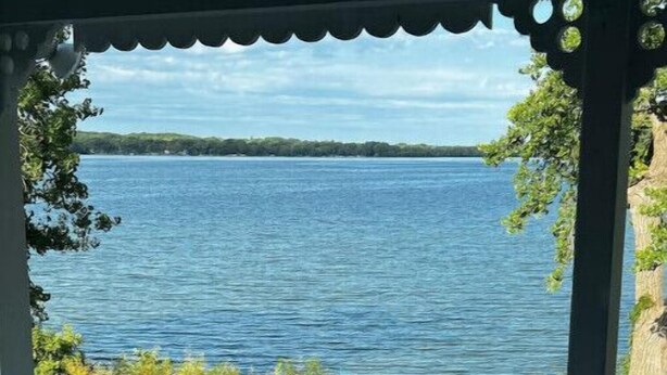 A covered outdoor area with a view of a large body of water. - Big Stone Lake, SD-Bayview area Lake Cabin (Big Stone City)