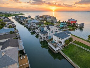 A waterfront residential area with houses connected by docks.