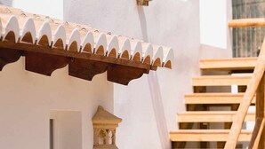 A white building with a wooden staircase and a small window. - CostaBlancaDreams - The Jave in Javea (Javea)