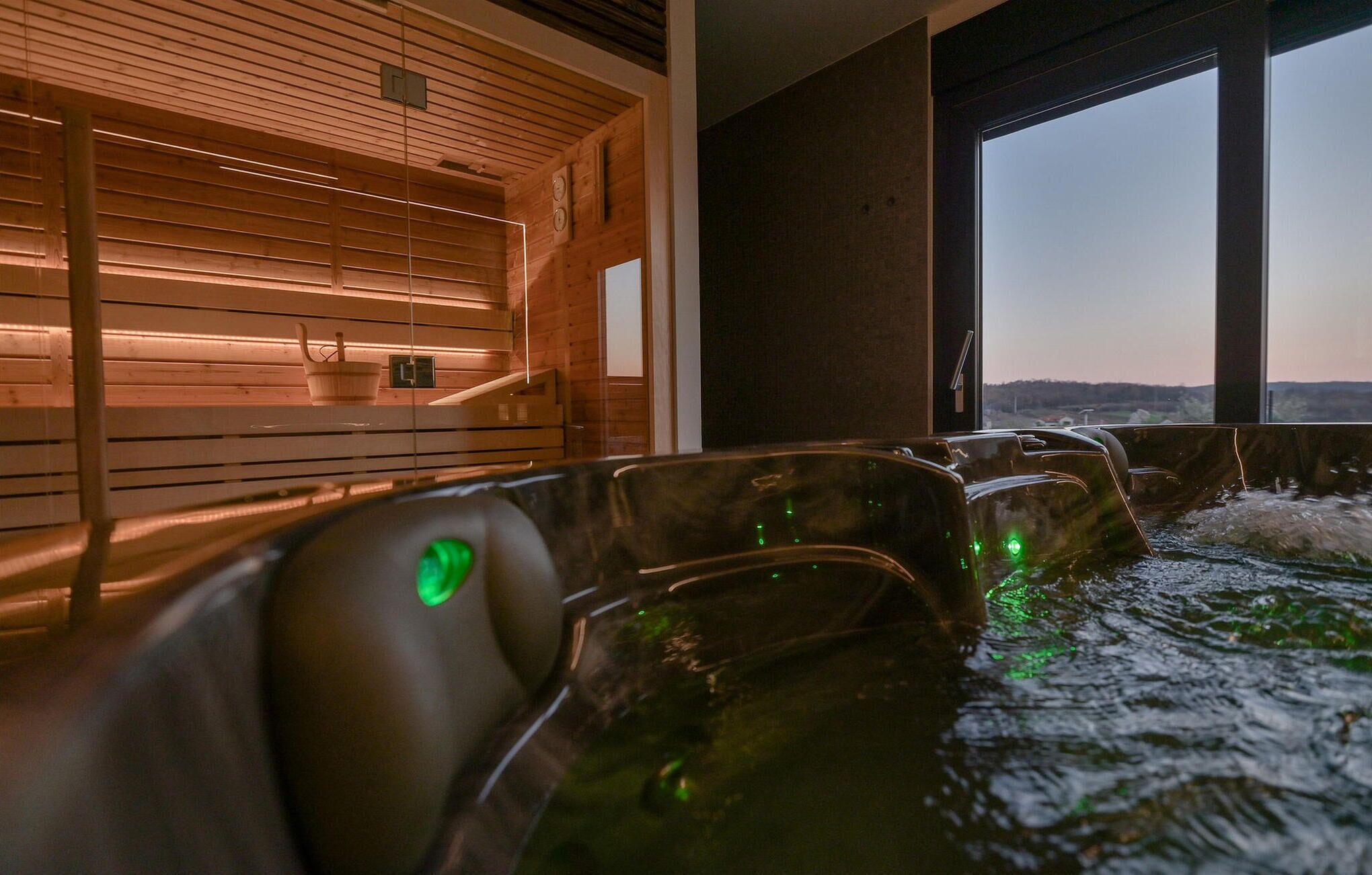 A sauna with wooden benches and a large window.