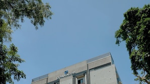 A multi-story hotel with a flat facade, balconies, and a sign indicating it is a hotel. - Dparagon Menteng (Jakarta)