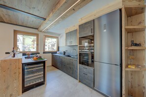 Family Apartment, Multiple Bedrooms, 2 Bathrooms (Wood House Livigno Ski in - Ski out) | Private kitchen | Fridge, microwave, oven, stovetop