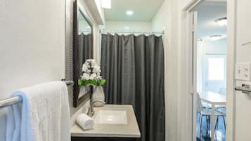Shower, eco-friendly toiletries, hair dryer, towels