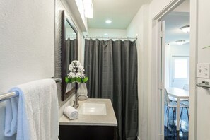 Shower, eco-friendly toiletries, hair dryer, towels
