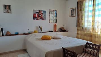 1 bedroom, desk, iron/ironing board, travel crib
